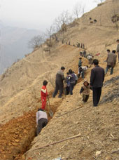 Digging a water-pipe trench in Baikun Village